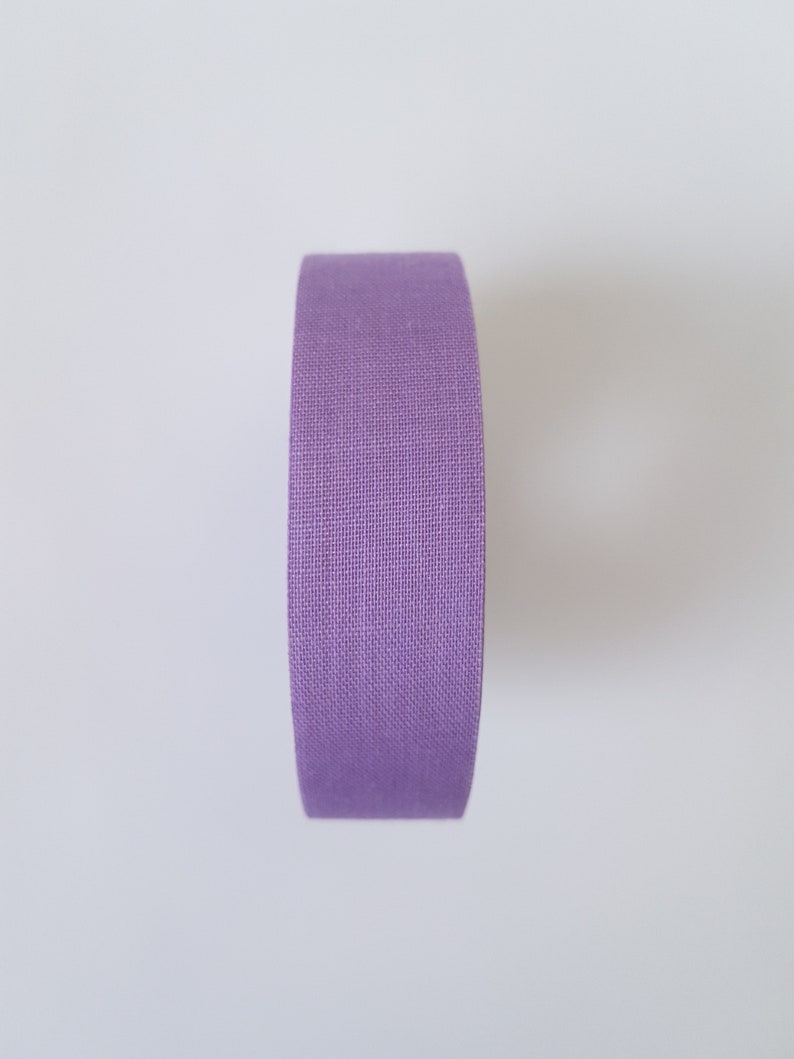 May include: A roll of purple fabric tape.