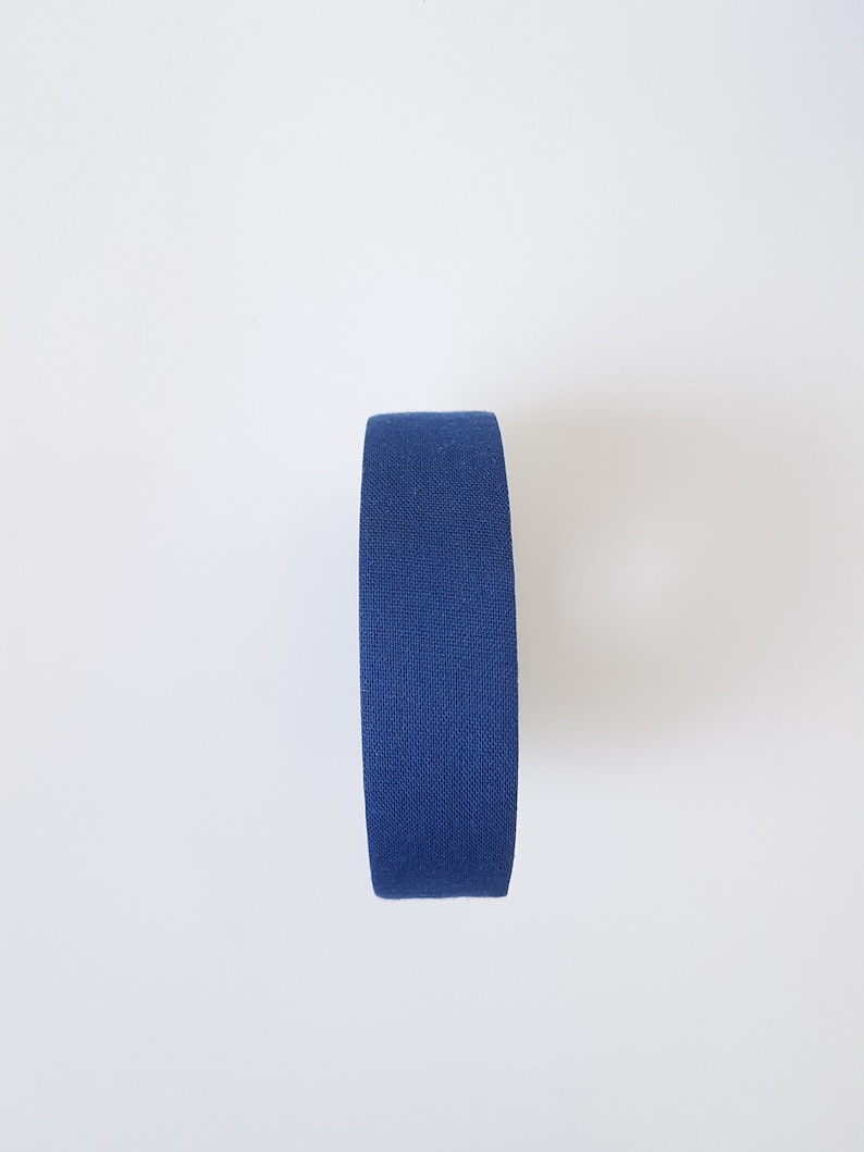 May include: A roll of blue athletic tape.