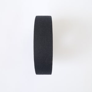 May include: A roll of black electrical tape.