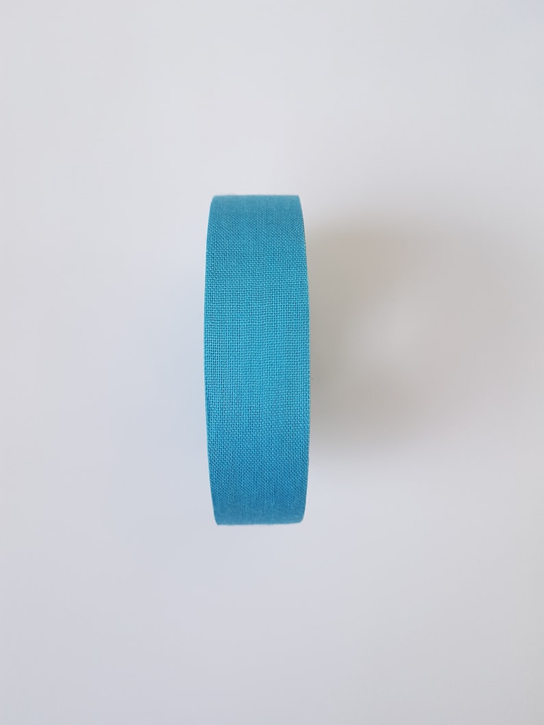 May include: A roll of blue fabric tape.