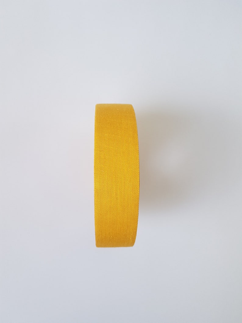 May include: A roll of yellow athletic tape.