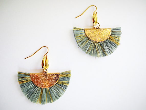 Gold tone fishhook earrings with an olive green thread wrapped ball and  fabric tassel. Approximately 4