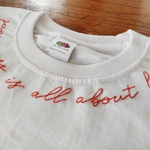 Queerness is all about love hand embroidered unisex t-shirt queer, love, self love, lgbt, embroidery image 1