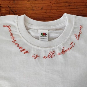 Queerness is all about love hand embroidered unisex t-shirt - queer, love, self love, lgbt+, embroidery