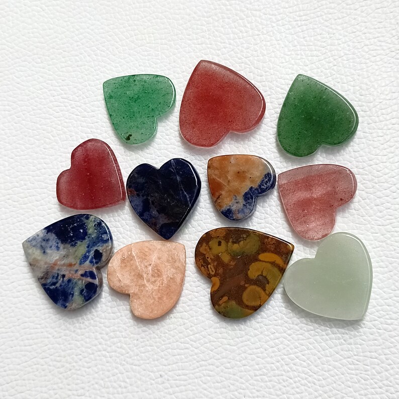 May include: Assortment of twelve heart-shaped polished stones in various colors, including green, red, blue, brown, and white.