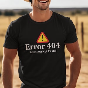 May include: Black t-shirt with a white warning sign and the text "Error 404 Costume Not Found".