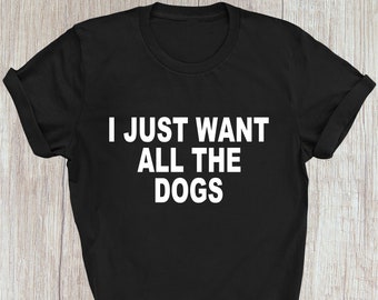 May include: Black t-shirt with white text that reads "I just want all the dogs".