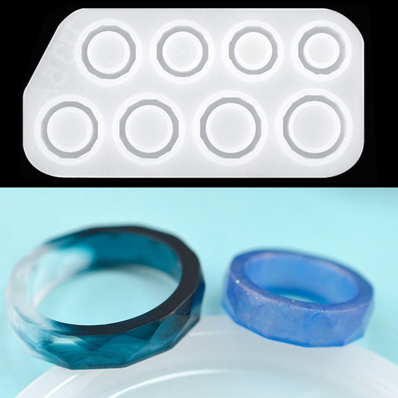 May include: A white silicone mold with eight ring-shaped cavities. Two rings are shown outside the mold, one is blue and the other is a teal and white swirl.