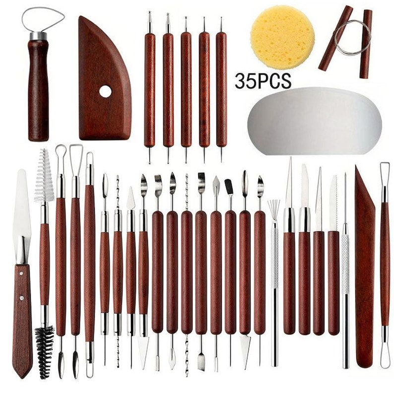 May include: A set of 35 pottery and sculpting tools. The tools include various shapes and sizes, with wooden handles and metal tips. A sponge, wire tool, and a curved wooden tool are also included. The text "35PCS" is visible.
