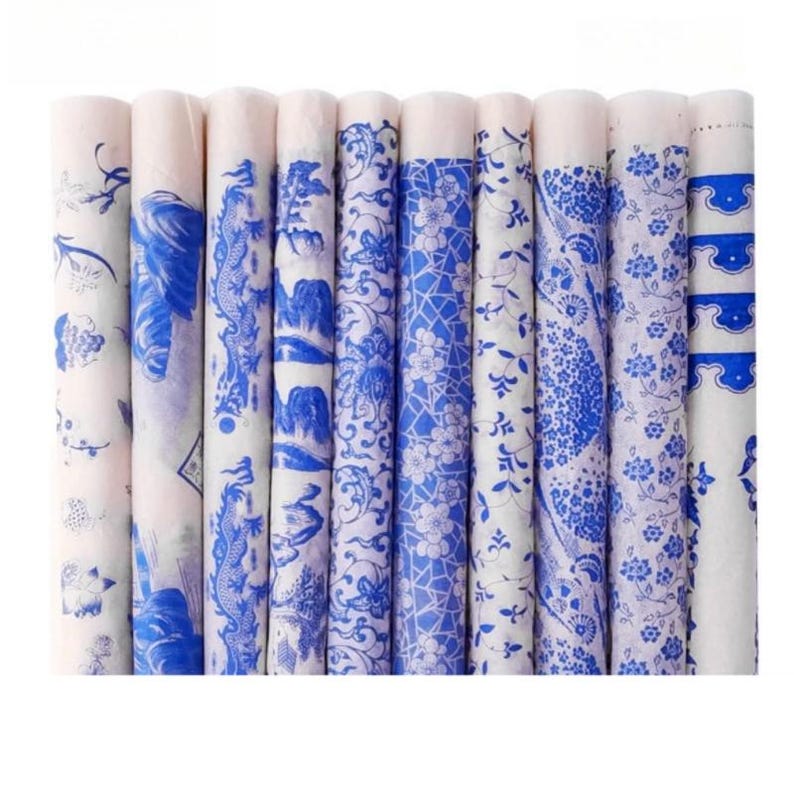 May include: A set of ten blue and white patterned tissue paper rolls. The patterns are inspired by traditional Chinese porcelain designs.