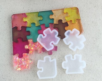 Juego de moldes de silicona con forma de piezas de rompecabezas para la creación de joyas de resina DIY.