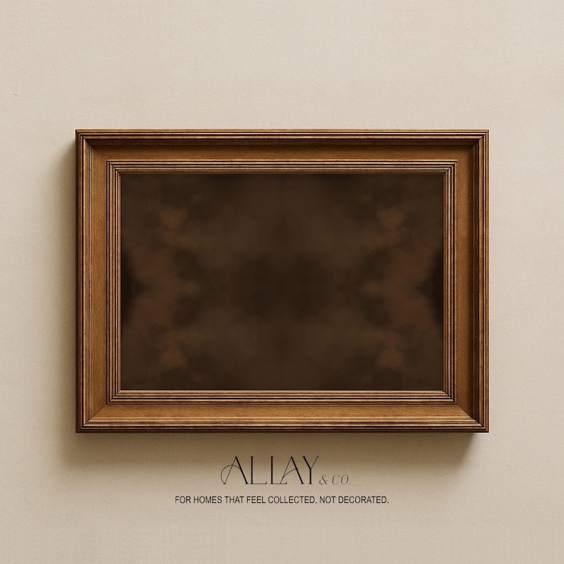 May include: A rectangular wooden picture frame with a dark brown finish and a multi-layered stepped edge design. The center is a dark, solid brown color. Below the frame, the text reads ALLAY & CO. FOR HOMES THAT FEEL COLLECTED, NOT DECORATED.