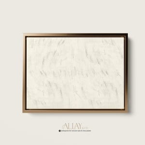 May include: A framed abstract painting with a white background and gray brushstrokes. The frame is a simple gold metal frame.