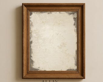 May include: A rectangular wall mirror featuring a medium-brown wooden frame with tiered molding. The glass has a distressed, antiqued finish with cloudy, mottled white and gray patches. Below the mirror, the text reads ALLAY & CO. FOR HOMES THAT FEEL COLLECTED, NOT DECORATED.