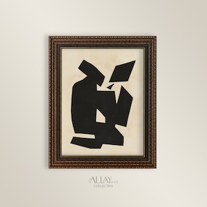 May include: Black and white abstract art print in a brown frame. The print features a geometric design of overlapping shapes.
