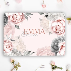 May include: A rectangular sign featuring a pale pink background decorated with large, detailed illustrations of peonies in shades of soft pink, white, and dark gray. The name EMMA Grace is printed in the center in a mix of serif and script fonts.