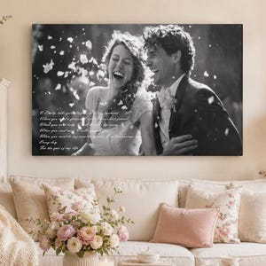 May include: A black and white rectangular canvas print featuring a laughing couple surrounded by falling petals. The text on the left side reads: I Emily, take you, my husband. When you need a friend, I will be your best friend. When you need hope, I will be there for you. When you need me, I will always be there. When you need to be something new, I will encourage you. Every day. You are the love of my life.