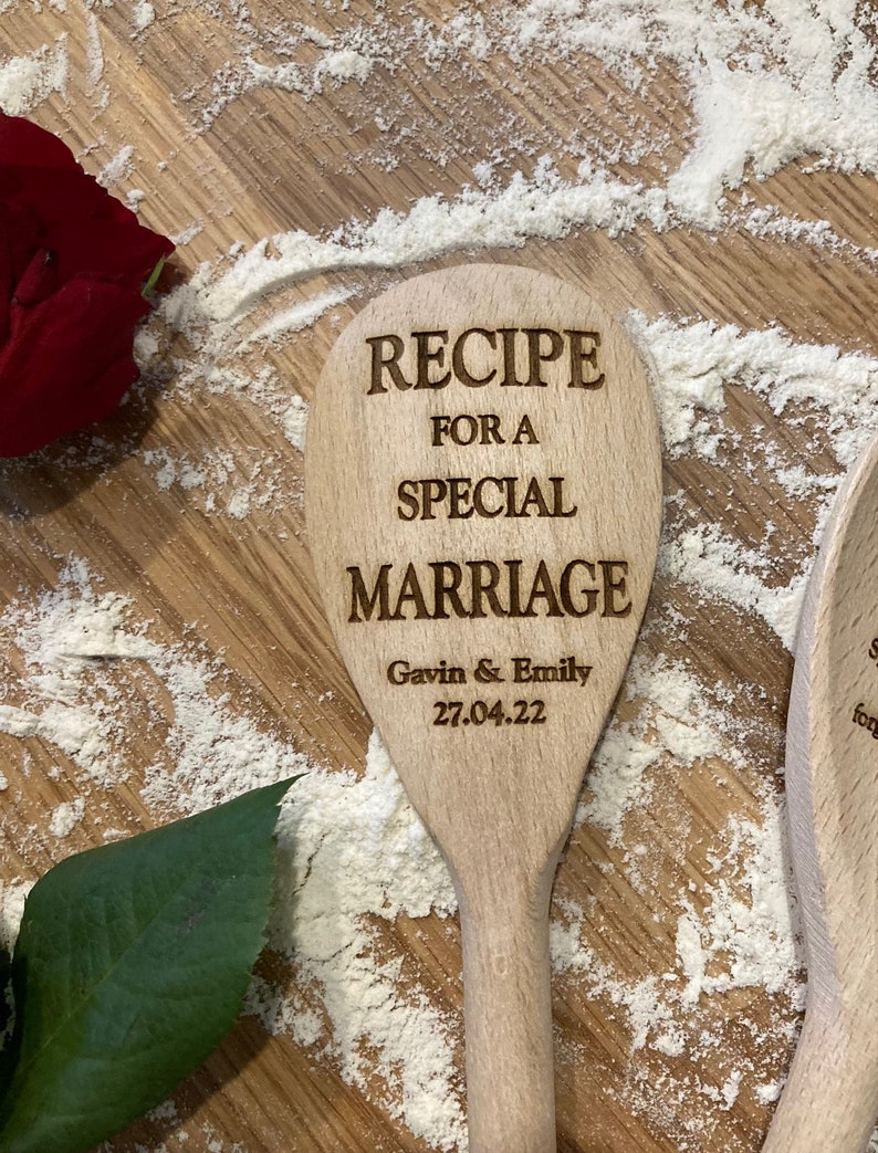 May include: Wooden spoon with the text "Recipe for a Special Marriage" engraved on it. The spoon also has the names "Gavin & Emily" and the date "27.04.22" engraved on it.