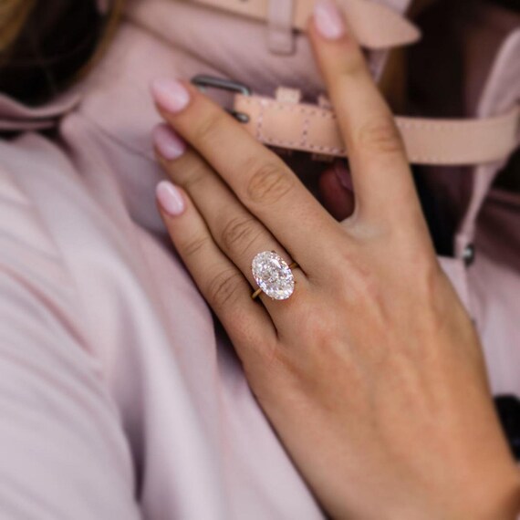 12 carat oval diamond ring Cinosural International School