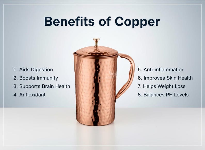 May include: A copper pitcher with a lid and handle, displayed against a gradient background. The text "Benefits of Copper" is at the top, with a list of health benefits below. The pitcher has a hammered texture.