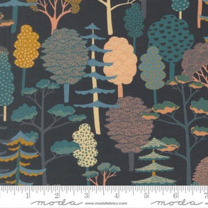May include: A dark gray fabric featuring a repeating pattern of stylized trees in shades of mustard yellow, teal, light blue, and muted pink. The trees have various textures including dots, lines, and waves. A white ruler is visible at the bottom.