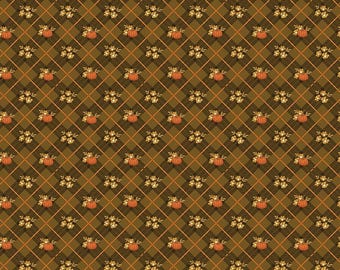 May include: A fabric print featuring a dark olive green and brown diagonal plaid pattern overlaid with repeating motifs of small orange pumpkins and clusters of light yellow flowers. A white ruler is visible at the bottom, measuring 12 inches.