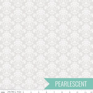 May include: A fabric with a repeating white damask pattern on a light gray background. The word "PEARLESCENT" is printed in white on a teal banner. The fabric is measured in inches.