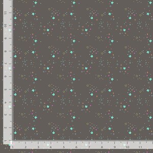 May include: A fabric with a repeating pattern of small, colorful shapes on a dark gray background. The design includes teal cat faces, pink hearts, orange crosses, and yellow circles. The fabric is measured in inches.