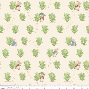 May include: A repeating pattern featuring illustrations of rabbits, lettuce, and footprints on a cream-colored background. The rabbits are depicted in various poses, some wearing blue jackets, others with brown fur. The lettuce is green, and the footprints are brown.