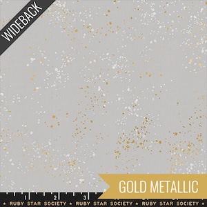 May include: Gray fabric with white and gold metallic splatter design. The text "WIDEBACK" is in the upper left corner. The text "GOLD METALLIC" is in a gold banner in the lower right corner. The text "RUBY STAR SOCIETY" is at the bottom.