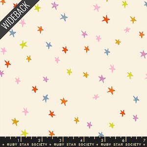May include: Cream-colored fabric with a scattered pattern of colorful stars in shades of orange, blue, pink, purple, and yellow. The fabric has the text "WIDEBACK" and "RUBY STAR SOCIETY".