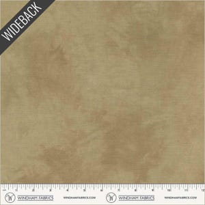 May include: Tan-colored fabric with a textured appearance. The fabric has a subtle, mottled effect, with darker areas creating depth. The word "WIDEBACK" is printed diagonally across the top left corner. The bottom edge features a ruler with inch markings.