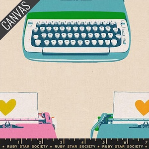 May include: A canvas print featuring a teal typewriter with a green top and white keys. Below, a pink and teal typewriter each have a sheet of paper with a yellow heart. The text "RUBY STAR SOCIETY" is at the bottom.