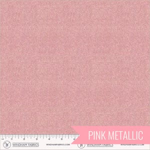 May include: Pink metallic fabric with a textured surface. The fabric has a subtle shimmer and a soft, rosy hue. A ruler is at the bottom of the image. The text "PINK METALLIC" is in a pink banner.