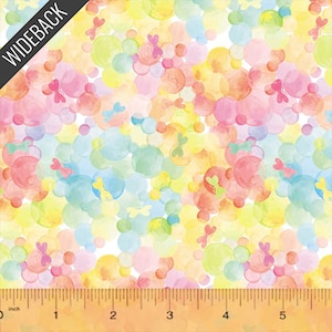 May include: Colorful fabric with a watercolor design featuring overlapping circles in shades of yellow, pink, orange, green, and blue. Small butterfly shapes are scattered throughout the design. A ruler is at the bottom, with measurements in inches.