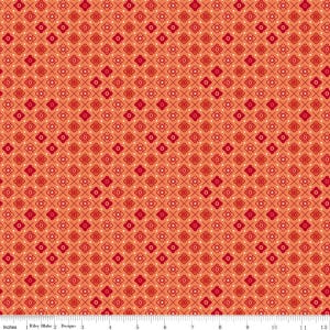 May include: Orange fabric with a repeating pattern of red flowers, crosses, and dots. The fabric is measured in inches along the bottom edge. The design is by Riley Blake Designs.