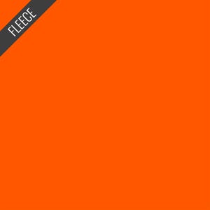 May include: Bright orange fleece fabric. The word "FLEECE" is printed in white on a diagonal black banner in the upper left corner. The fabric is a solid, vibrant orange color.