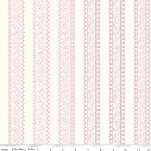 May include: A fabric with a repeating vertical stripe pattern. The stripes alternate between a cream color and a pink floral lace design. The image includes a ruler with inches.
