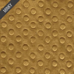 May include: A close-up of a gold minky fabric with a textured pattern of small circles.