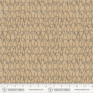 May include: Tan fabric with a repeating pattern of dark gray, interconnected oval shapes. The fabric has a ruler along the bottom edge with the Windham Fabrics logo and website address.