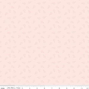 May include: A light peach-colored fabric with a repeating pattern of small, delicate flowers. The flowers are outlined in a lighter shade, creating a subtle, all-over design. The fabric is measured in inches.