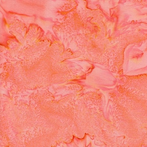 May include: A fabric swatch featuring a vibrant coral and peach batik pattern. The design displays an organic, mottled texture with varying shades of pink and orange, creating a fluid, marbled effect across the surface of the textile material.
