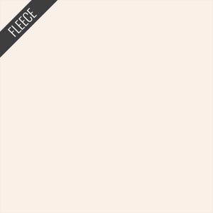 May include: A solid, off-white fleece fabric. The word "FLEECE" is printed in white on a diagonal black banner in the upper left corner. The fabric has a soft, neutral tone.