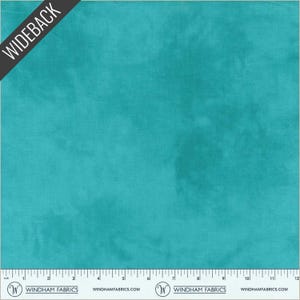 May include: A square of turquoise fabric with a mottled appearance. The fabric has a subtle texture and a watercolor-like effect. The word "WIDEBACK" is printed diagonally across the top left corner. A ruler is at the bottom with the Windham Fabrics logo.
