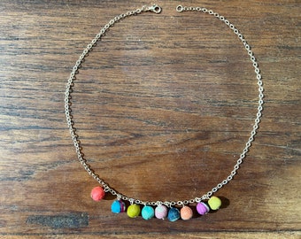 Colourful repurposed Kantha fabric beads on a gold chain necklace