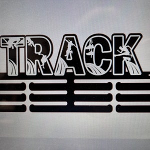 May include: Black metal medal display rack with the word "TRACK" in large letters. The letters are decorated with white silhouettes of people surfing.
