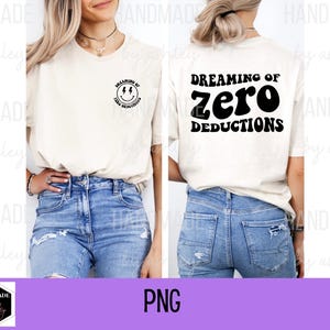 May include: A white t-shirt with a black smiley face graphic on the left side and the text "Dreaming of Zero Deductions" on the right side.