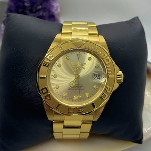 Bold Brilliance: Invicta Ocean Ghost Silver Dial Gold-tone Steel Men’s Watch