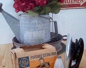 Vintage portable steam iron by GE