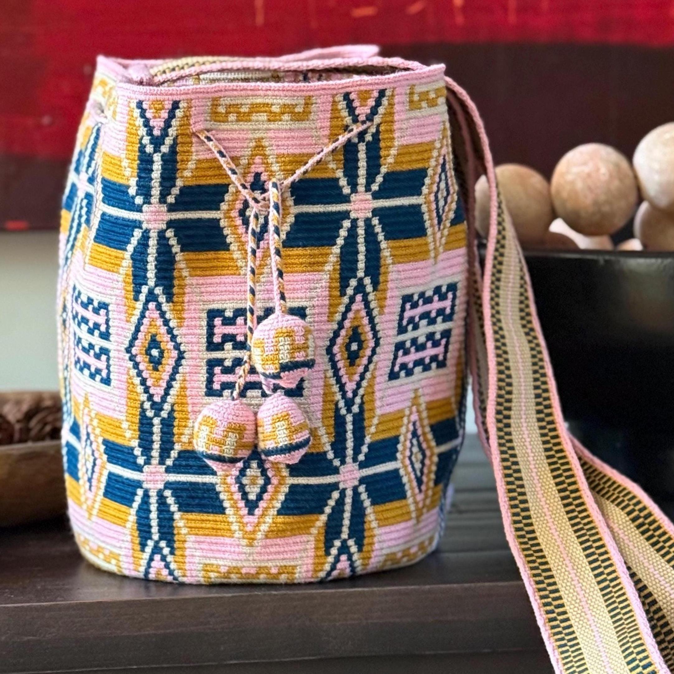One thread crochet handmade Wayuu bag with geometric originals Wayuu desing in elegant soft pink color and blue. Crossbody/shoulder bag